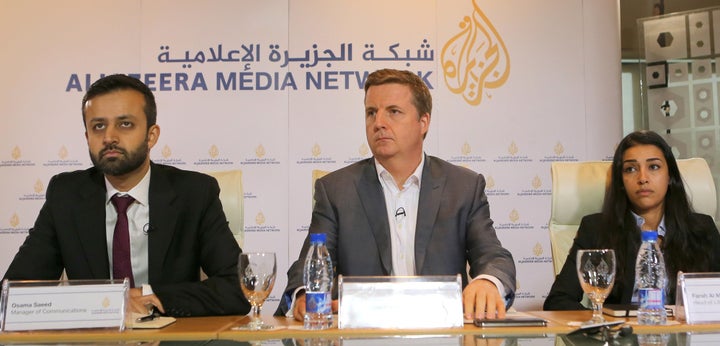 Osama Saeed (L), Manager of Communications of Al Jazeera English, Giles Trendle (C), managing director of Al Jazeera English and Farah Al-Muftah, Head of Litigation, attend a press conference following the verdict in the case of three Al-Jazeera journalists in the Qatari capital, Doha, on August 29, 2015. 