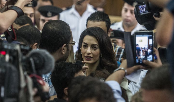 <p>Amal Clooney speaks to reporters during Fahmy's trial on Aug. 29, 2015. </p>