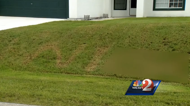 A Florida man found a racial slur burned into his front yard.