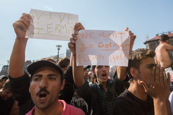 <p>Men protest outside of the Keleti train station in Budapest, Hungary on Wednesday, Sept. 2. Hungarian officials barred thousands from boarding trains to Germany.</p>