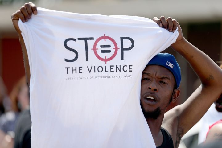<p>A protester advocates against police brutality in St. Louis.</p>