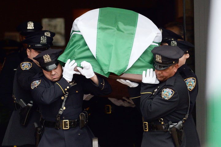 <p>Officers carry the casket of Wenjian Liu, a NYPD officer killed along with his partner, Rafael Ramos, in December 2014.</p>