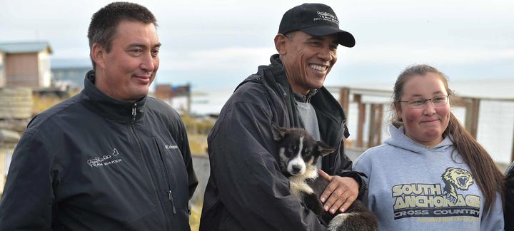 President Barack Obama cuddles with a puppy Wednesday.