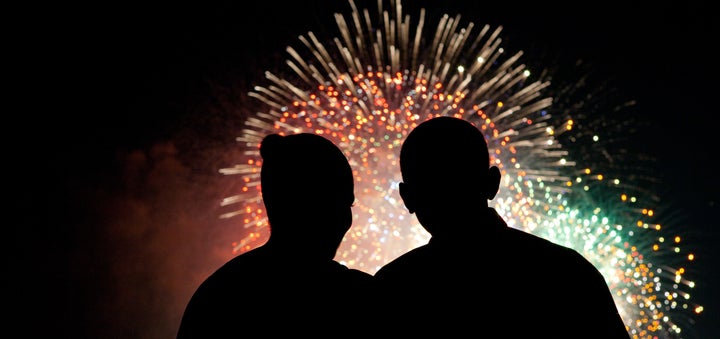 First lady Michelle Obama and President Barack Obama watch fireworks over the National Mall on Independence Day.