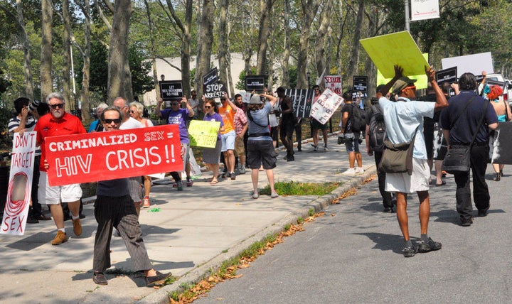 People gathered across from the federal courthouse in Brooklyn on Thursday to protest the raid on Rentboy.com last week.