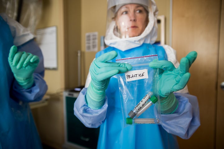 Nurse Jody Walsh holds a bag of empty vials during a University of Minnesota Medical Center's Ebola preparedness drill on June 25, 2015. 