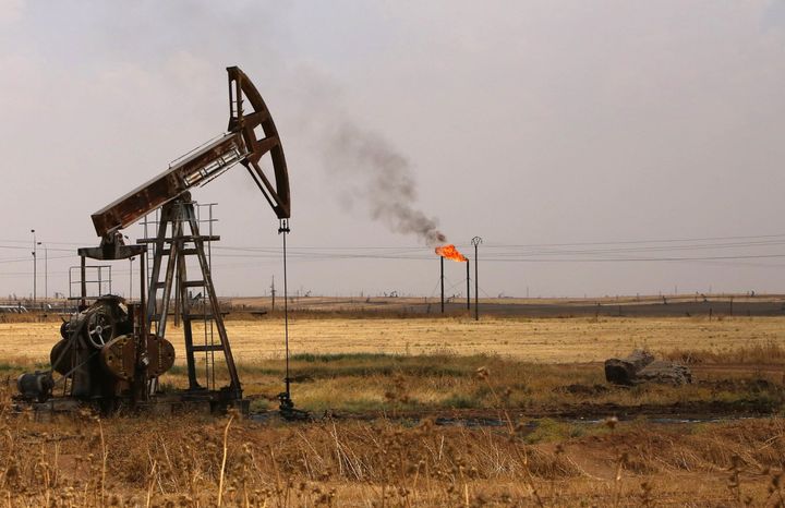 <p>Oil well pumps are seen in the Rmeilane oil field in Syria's northerneastern Hasakeh province on July 15, 2015. </p>
