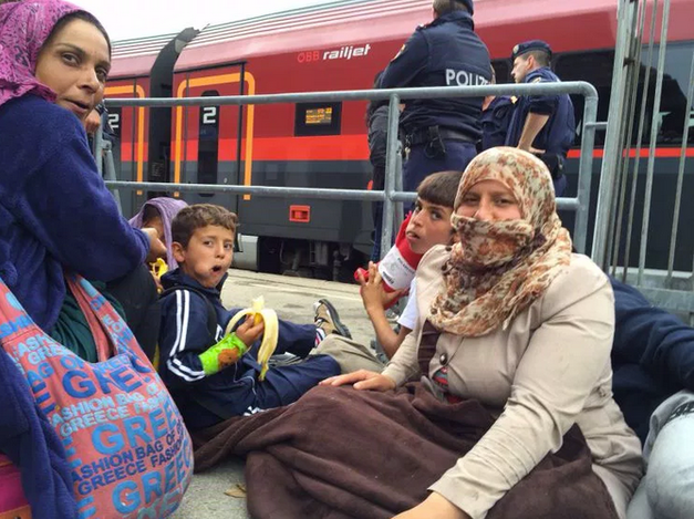 Syrian families wait to board trains in Nickelsdorf, Austria.
