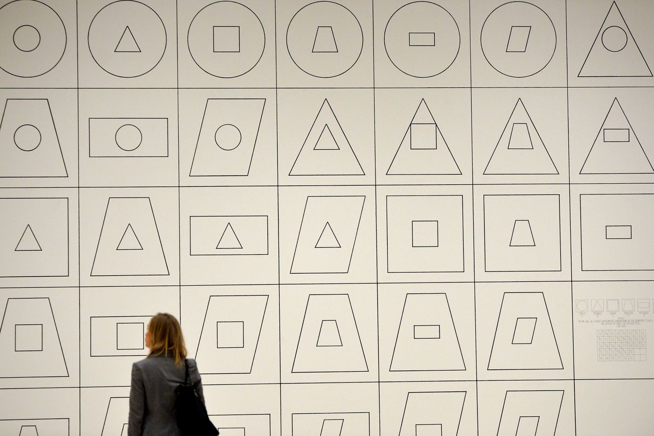 A woman looks at a piece of art by Sol LeWitt. (GABRIEL BOUYS/AFP/Getty Images)