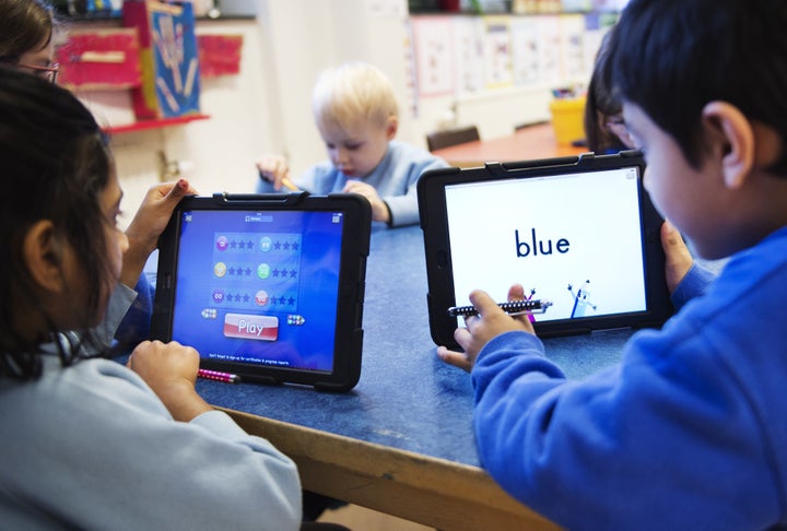 Nursery school pupils work with iPads on March 3, 2014 in Stockholm. 