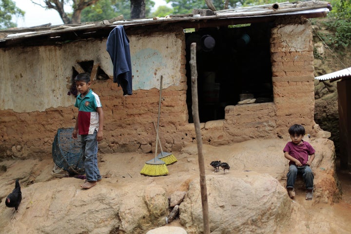 Children stay in front of their humble home in El Magueyito, Guerrero State, Mexico, on July 19, 2015.