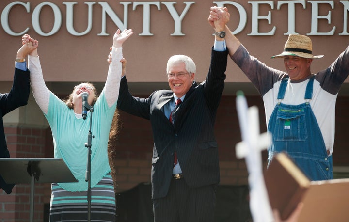 Mathew Staver, center, said Wednesday that forcing Kentucky county clerk Kim Davis, left, to do her job would be like making