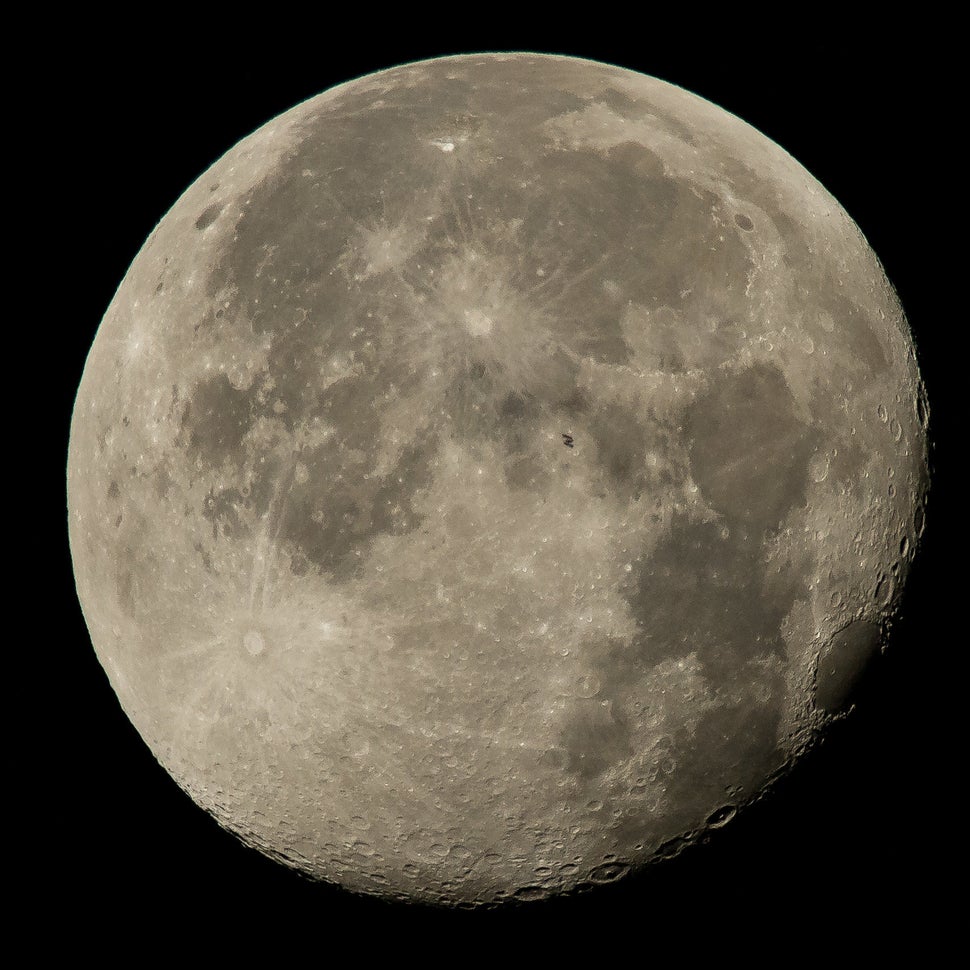 <span>This NASA photo shows the ISS silhouetted against the moon. </span>