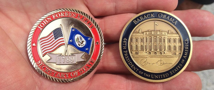 Secretary of State John Kerry and President Barack Obama's challenge coins.