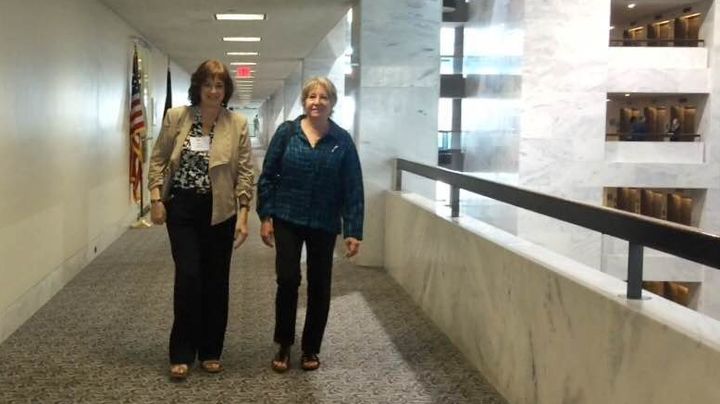 Karen Meredith and Michelle DeFord walk in the Hart Senate Office Building, where they talked with lawmakers about their support for the Iran deal.