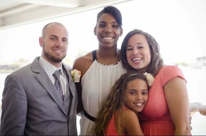 Reshanda Gray with Tyrone Dinneen, his wife, Marisa Blackshire, and their daughter.