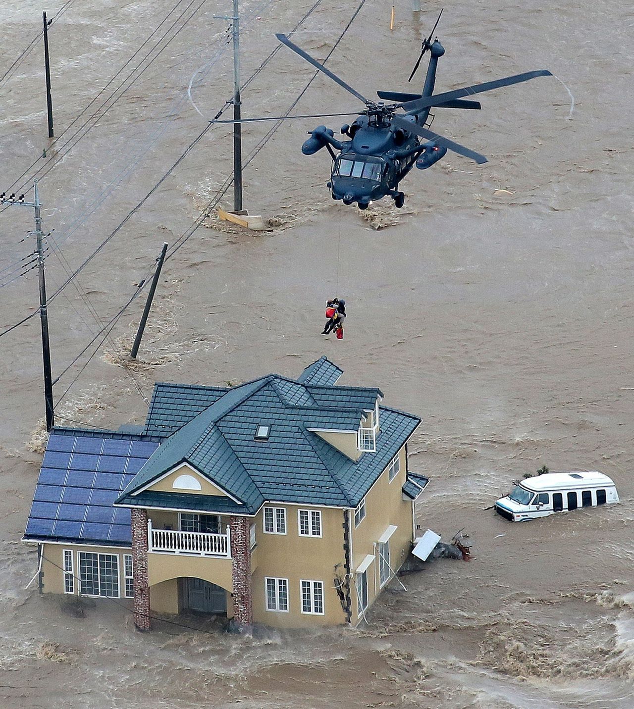 Local residents were rescued from their flooded home by a helicopter of the Ground Self Defence Force in Joso, Japan.