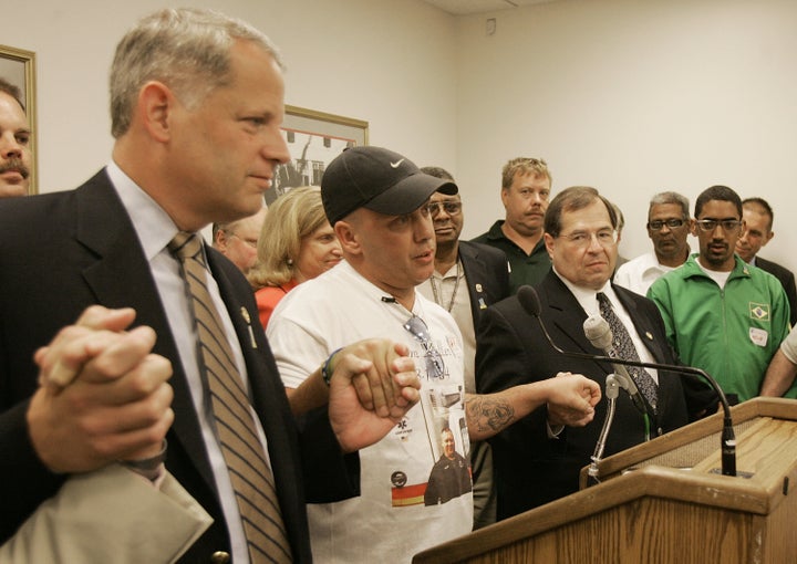 John Feal is flanked by Rep Steve J. Israel (D-NY) (L) and Rep. Jerrold Nadler (D-NY) (C) talks about his injuries during a news conference about illnesses that 9/11 responders have reported on Capitol Hill July 21, 2005 in Washington, DC