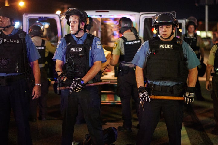 Police deployed during a civil disobedience action on August 10, 2015 on West Florissant Avenue in Ferguson, Missouri. The ni
