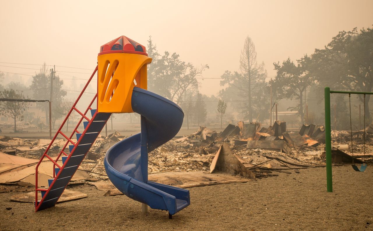 A playground is surrounded by smoldering rubble in Middletown, California, Sept. 13, 2015.