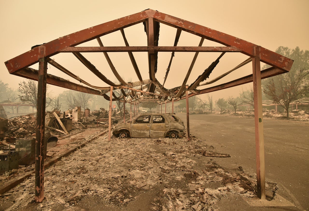 Burned out vehicles are surrounded by smoldering rubble in Middletown, California, Sept. 13, 2015.
