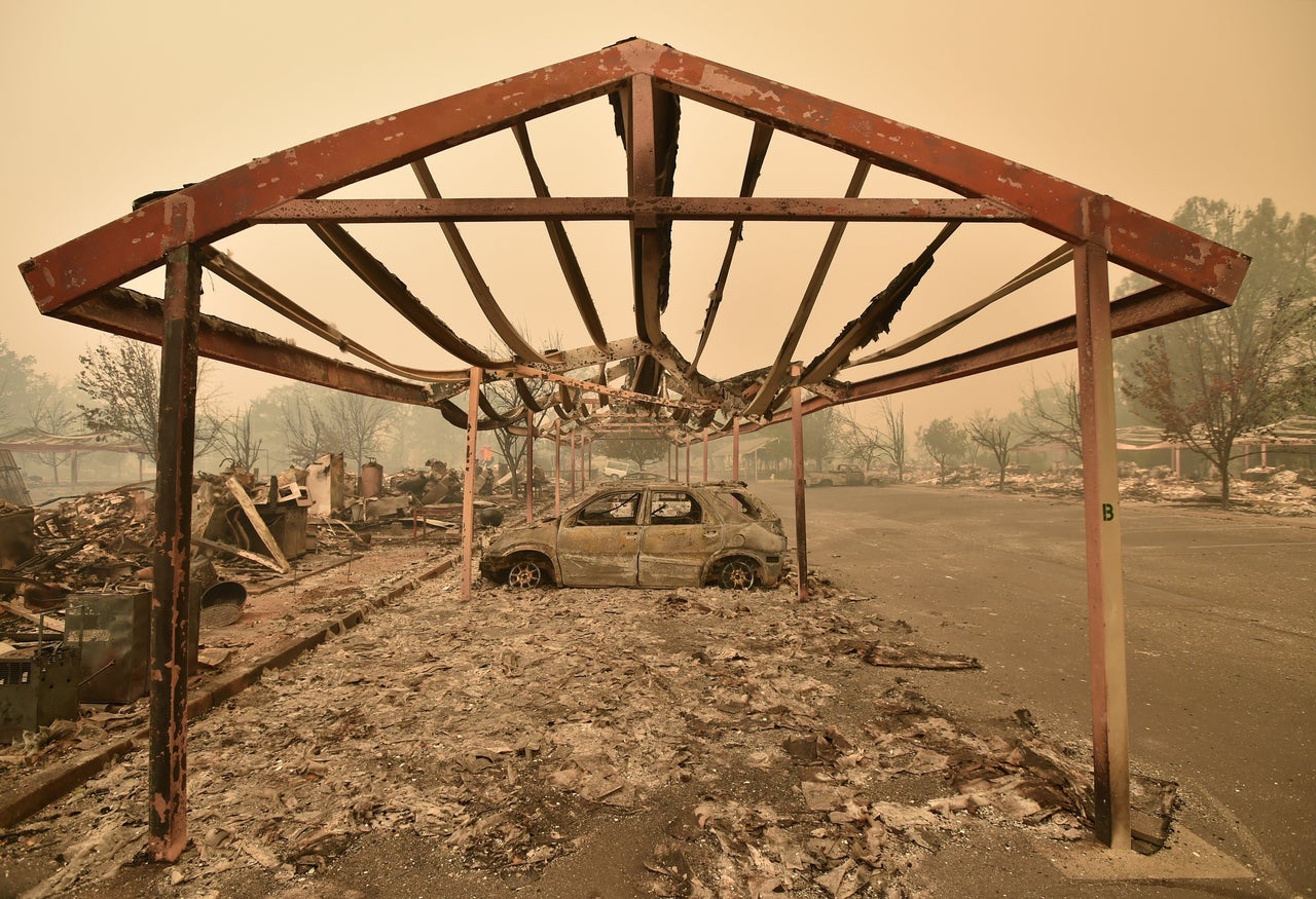 Burned out vehicles are surrounded by smoldering rubble in Middletown, California, Sept. 13, 2015. 