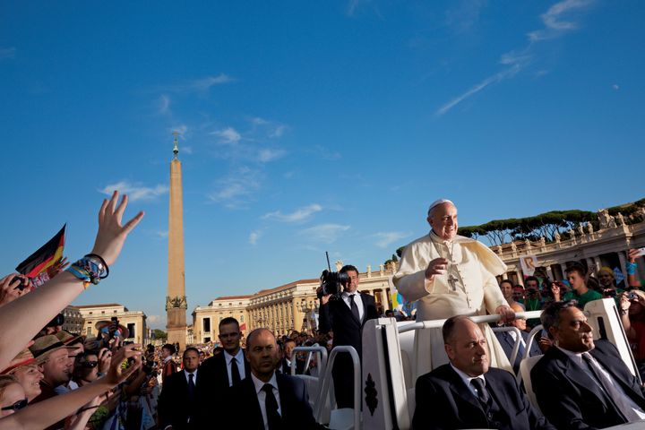 The open-topped Popemobile carries Pope Francis through a delighted crowd during a Wednesday general audience in St. Peter’s Square.