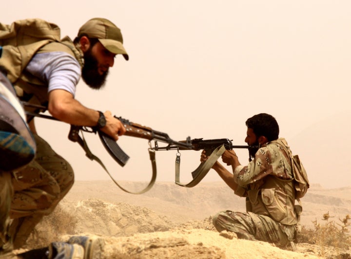 Syrian opposition members fight against Assad Regime Forces in Tall Kurdi village, Damascus, Syria on September 12, 2015.