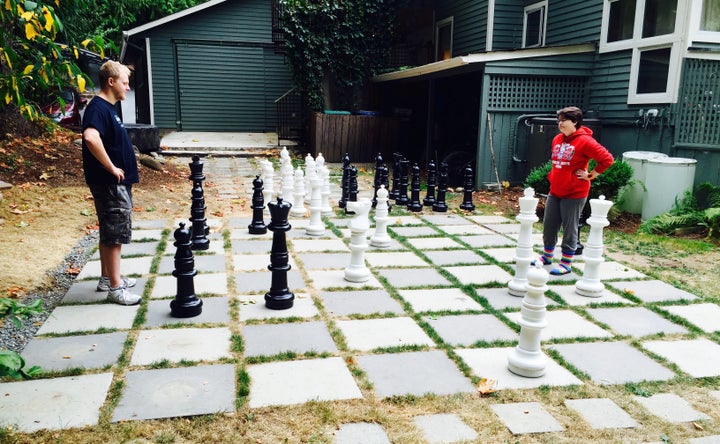 Chloe Mason faces off with Tom, a fellow client, in a game of chess at the reSTART Center.