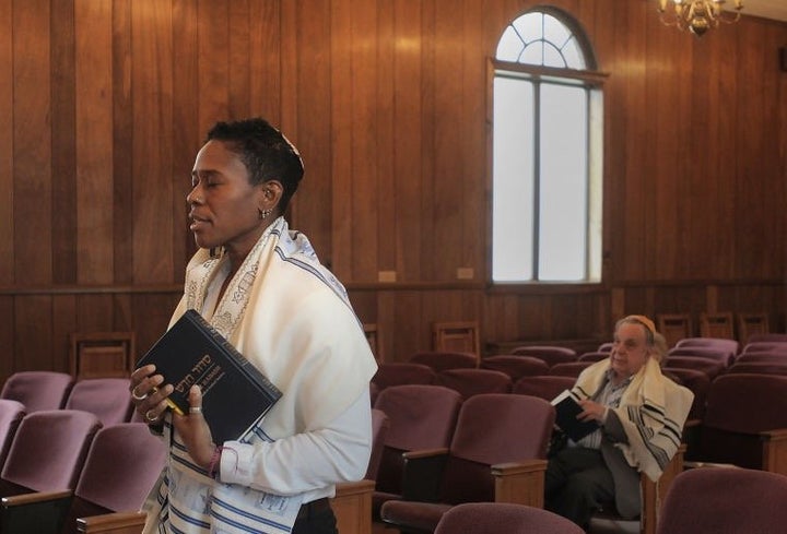 Sandra Lawson prays at the Bristol Jewish Center.