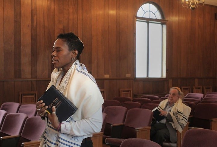 Sandra Lawson prays at the Bristol Jewish Center. 