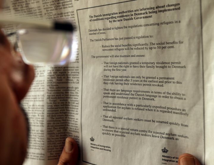 A Lebanese man looks at an advertisement published in "As-Safir" daily newspaper in Arabic by the Danish Ministry of Immigration and Integration to warn would-be migrants about new and tighter restrictions on those seeking asylum in the country on September 8, 2015 in Beirut.