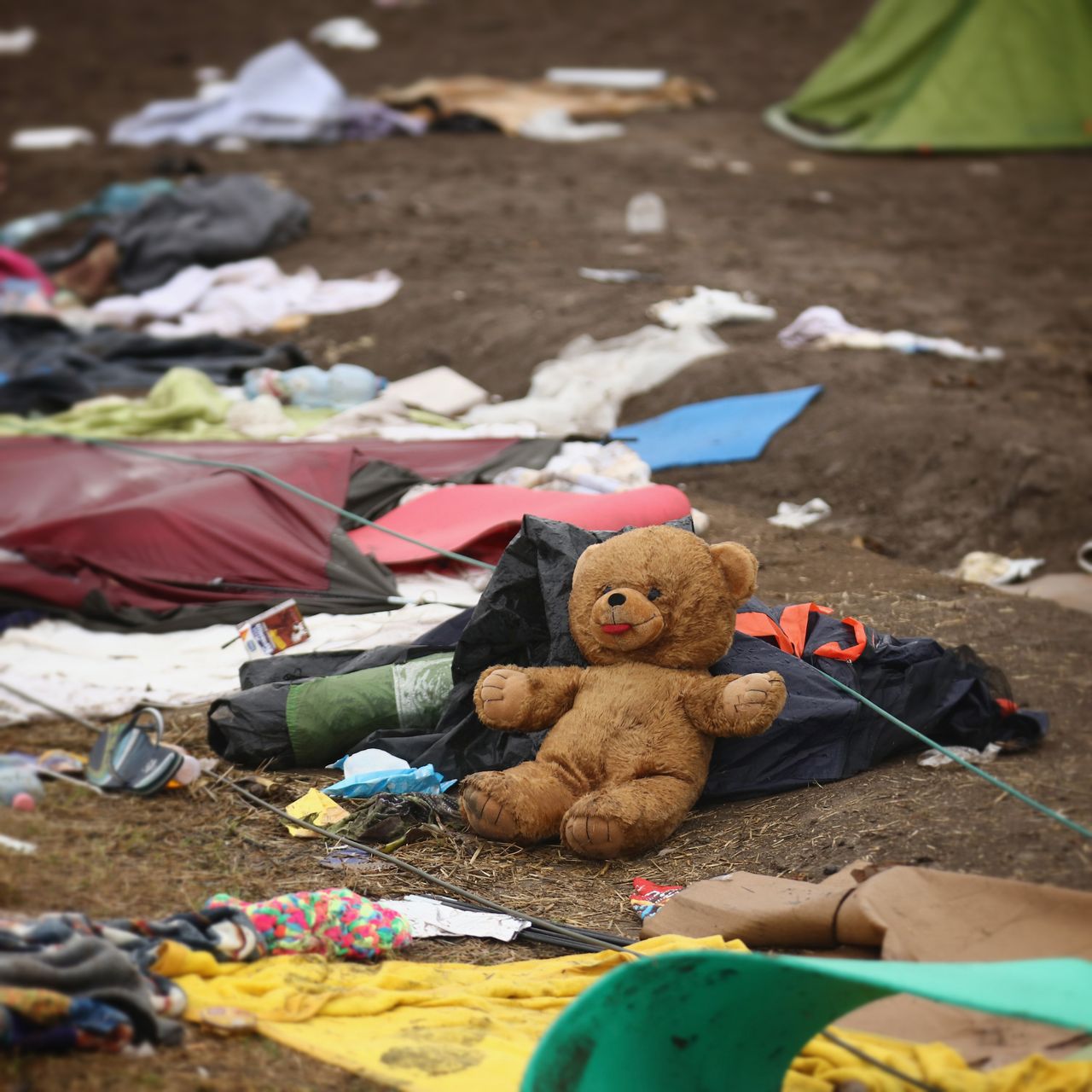 A teddy bear, tents and clothing.
