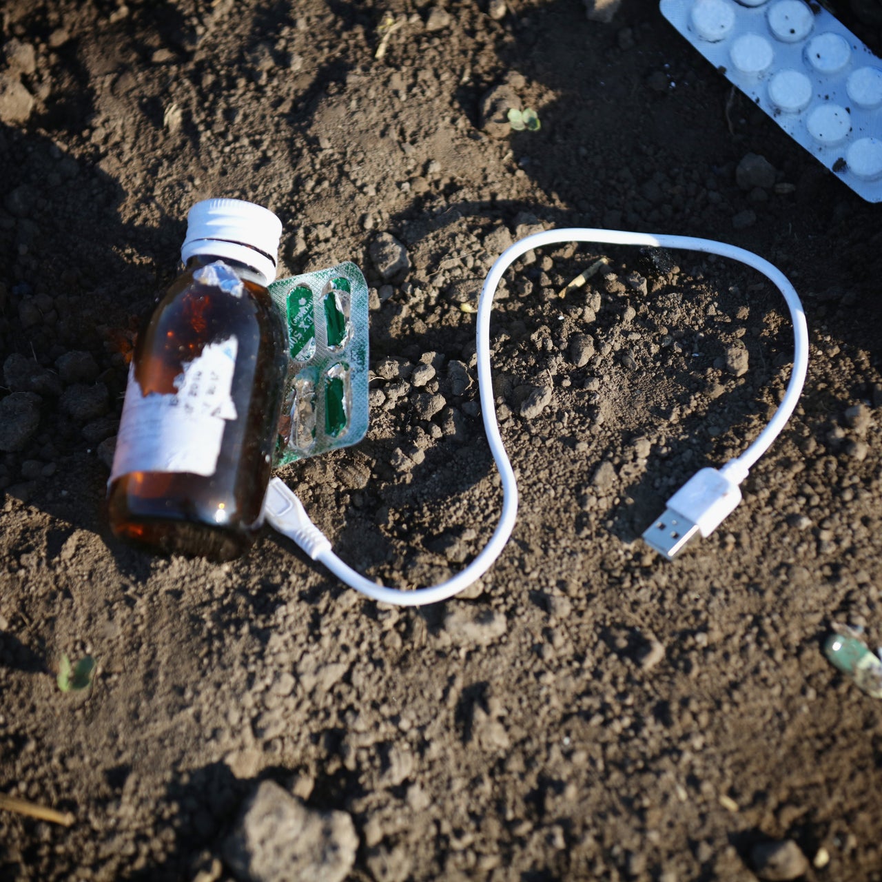 Medicine and a charging cable.