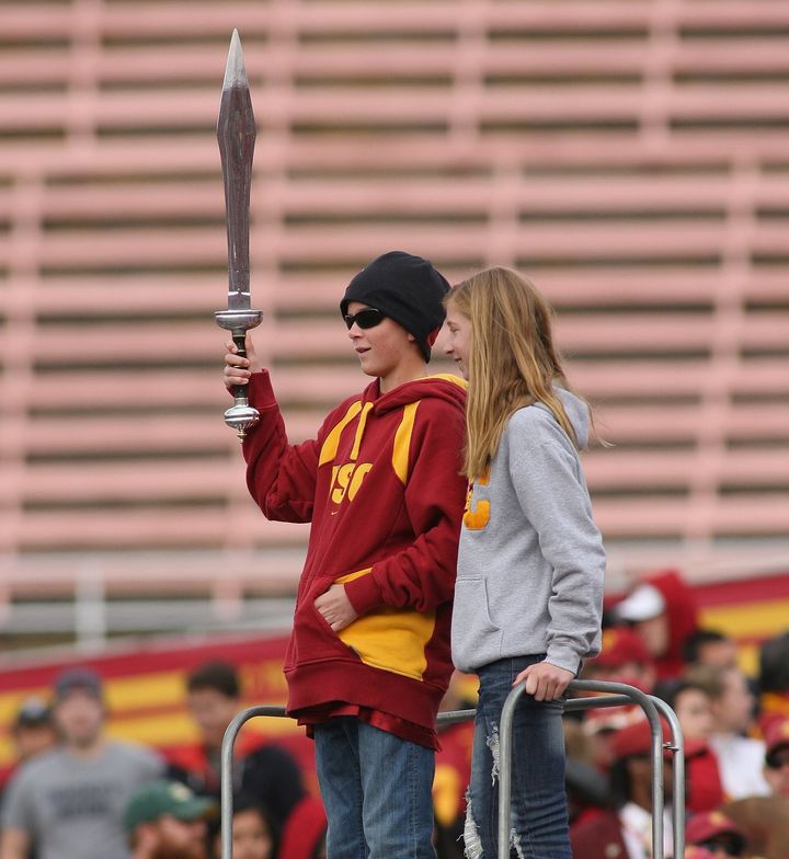 Jake Olson leads the marching band with his sister back in December 2009.