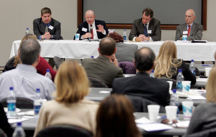 Daniel Carter, at left, is seen at a program about campus safety as part of the AP Day at the Capitol in Richmond, Virginia, Tuesday, Dec. 4, 2007.