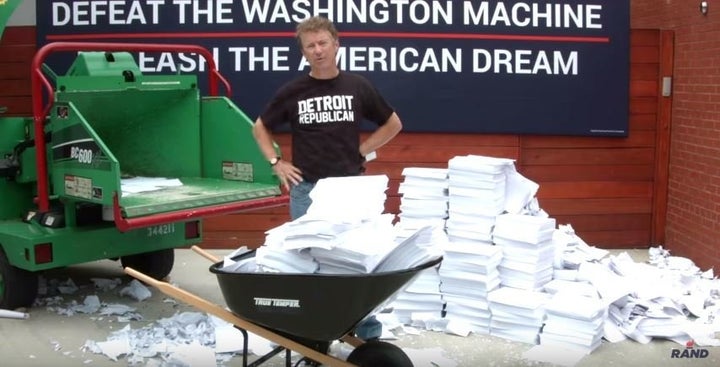 Some poor staffer has to keep printing out and lugging around the tax code for Rand Paul to destroy.