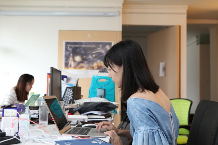 A College Daily employee at work in their Beijing office. 