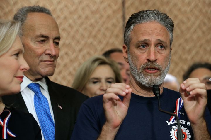 Sen. Chuck Schumer looks on as comedian Jon Stewart urges Congress to renew aid for 9/11 first responders on Wednesday