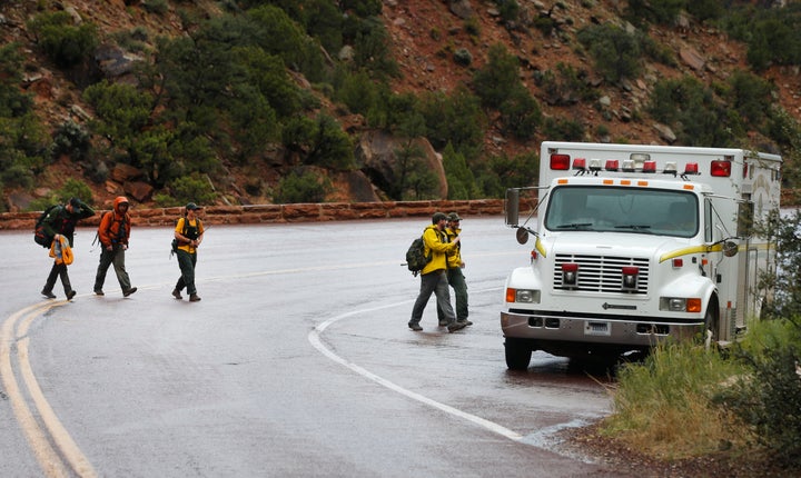 Search and rescue personal finish their day of searching Pine Creek in Zion's National Park for lost hikers on September 15, 2015 in Springdale, Utah.