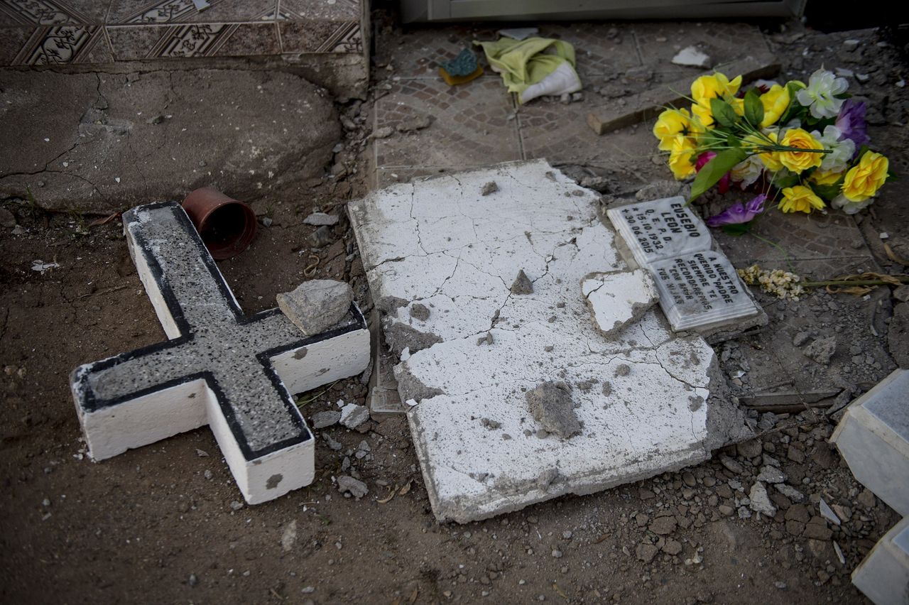 A headstone is damaged in a cemetery in Illapel, Chile, on Sept. 17, 2015.
