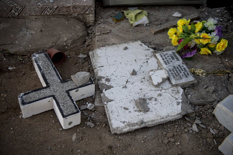 A headstone is damaged in a cemetery in Illapel, Chile, on Sept. 17,
