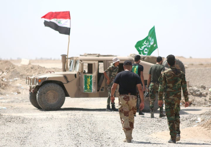Shiite militia fighters on the front line against the Islamic State group in Iraq's Anbar province on Aug. 19.