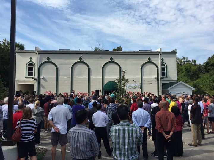 Louisville residents gather for a clean up at the vandalized Islamic Center.