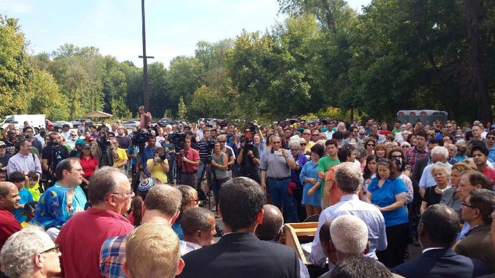 Mayor Greg Fischer addresses the crowd gathered for a clean up at the Louisville Islamic Center.