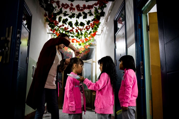 Ms. Liu, the caretaker of the Green Harbor Red-Ribbon School.