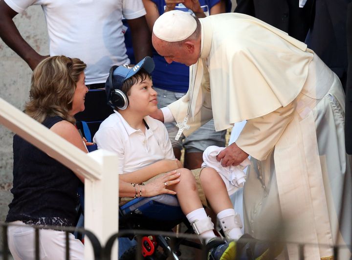 HAVANA, CUBA - SEPTEMBER 20: Pope Francis greets a disabled boy as leaves following a visit to the Father Felix Varela cultural center on September 20, 2015 in Havana, Cuba. 