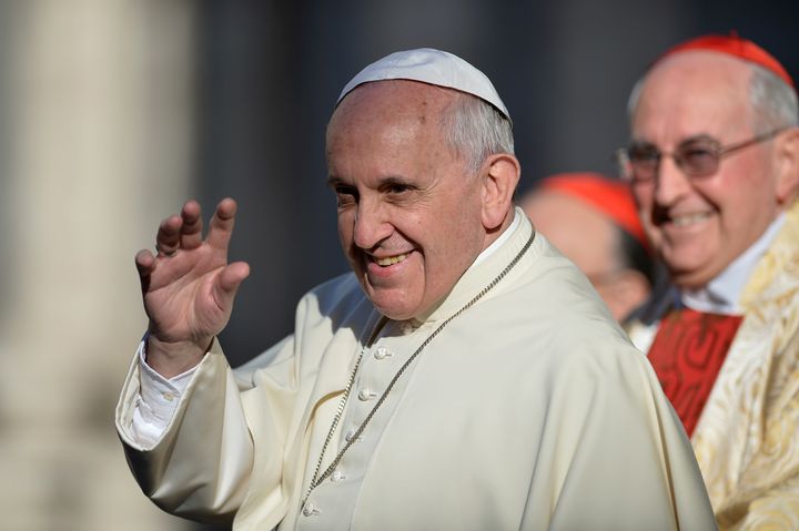 Pope Francis greets people as he arrives at the Sant' Ignazio di Loyola church on April 24, 2014 in Rome.