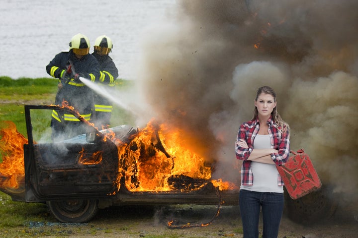 Scorned girlfriend, Amy, stands by as her cheating bastard boyfriend's car, much like their relationship, disintegrates
