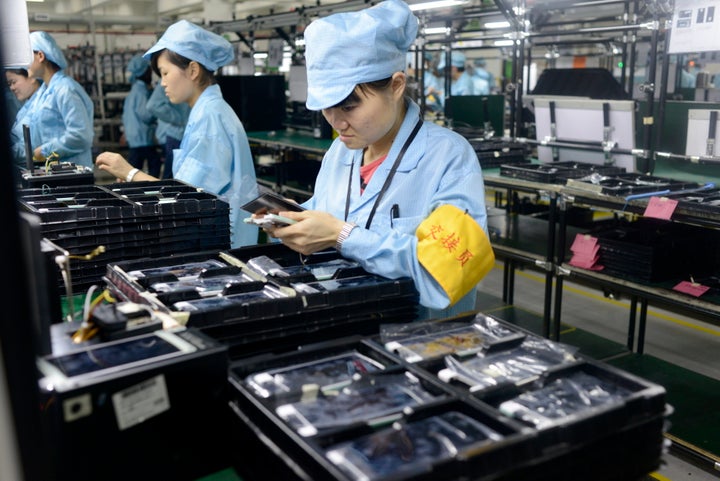 Workers produce electronic products in Dongguan, Guangdong province of China. Chinese manufacturing has been performing